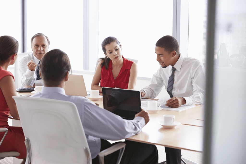 five businesspeople having meeting in boardroom praes8j