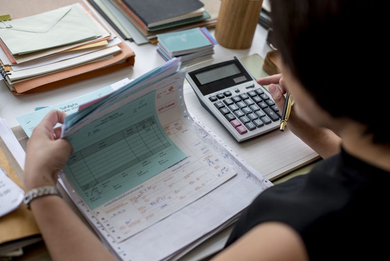 adult asian woman working on payment bills accounting summary da